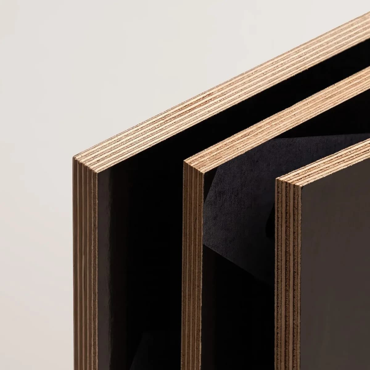 Film-faced plywood sheets edge-on in close-up