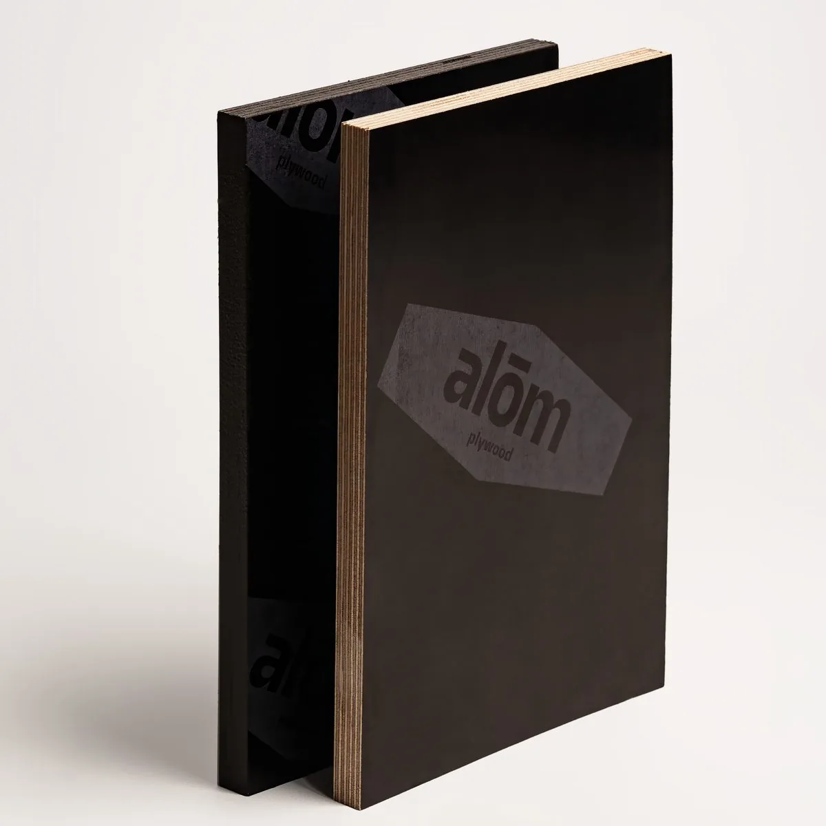 The black-brown film surface of laminated plywood in close-up